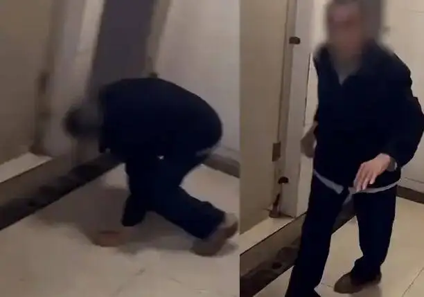 老人趴女厕被质问后逃跑